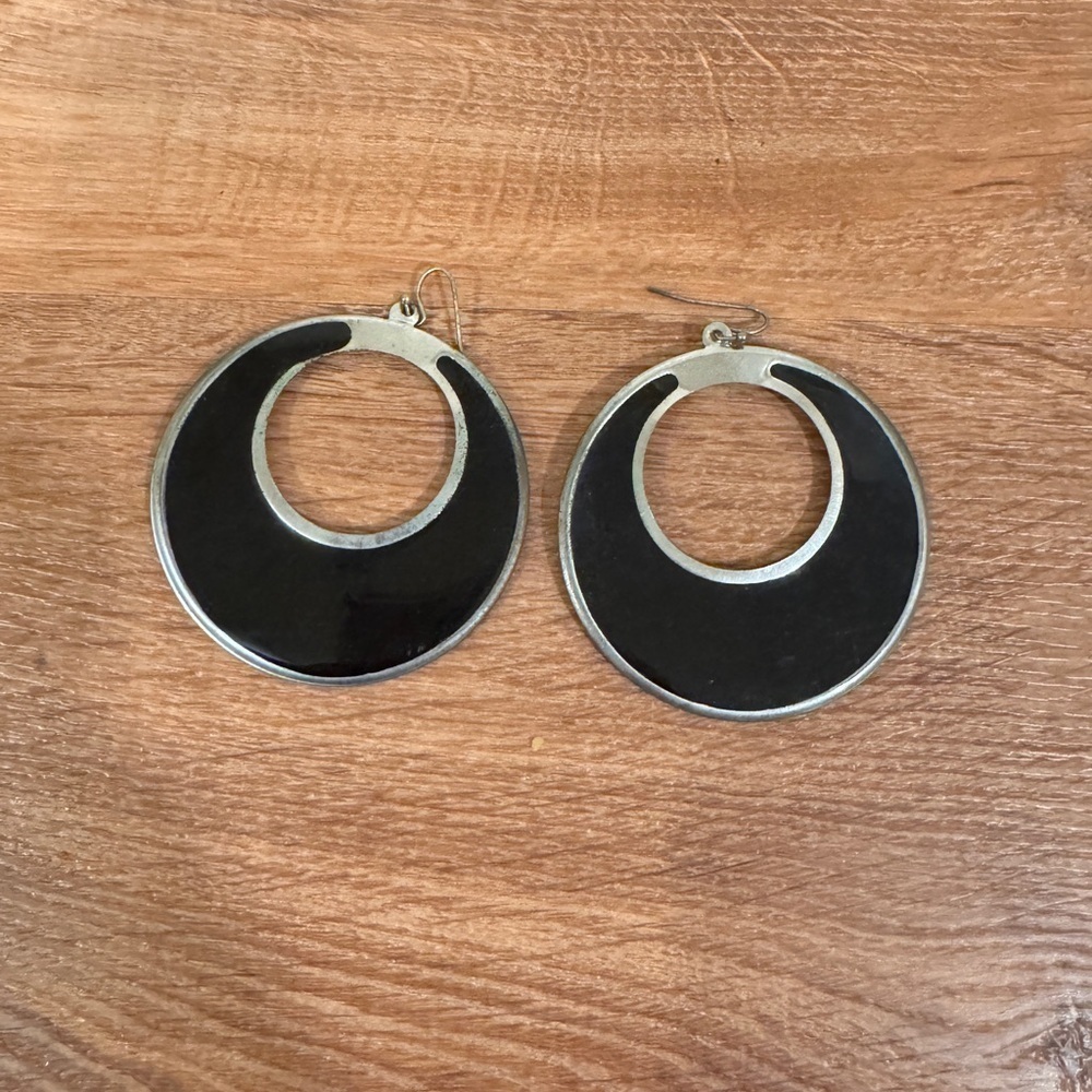 Black and silver toned dangle hoop earrings​​​​​​